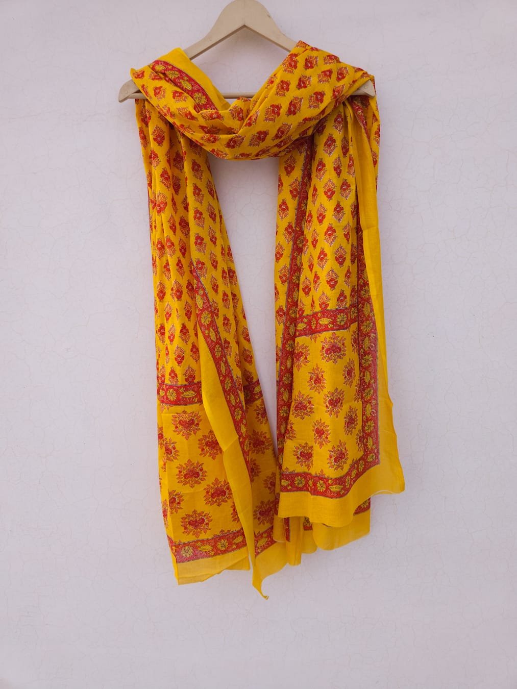 Cotton Mulmul Border Dupatta in yellow shades with red butta prints