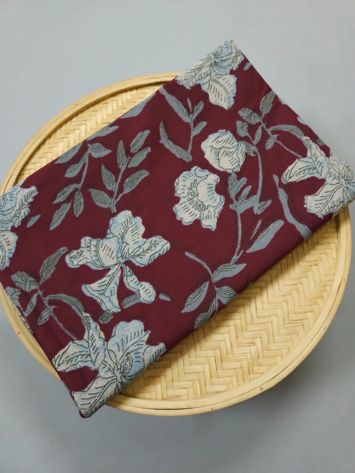Traditional Ajrakh Jaal Print ON Maroon Base Background.