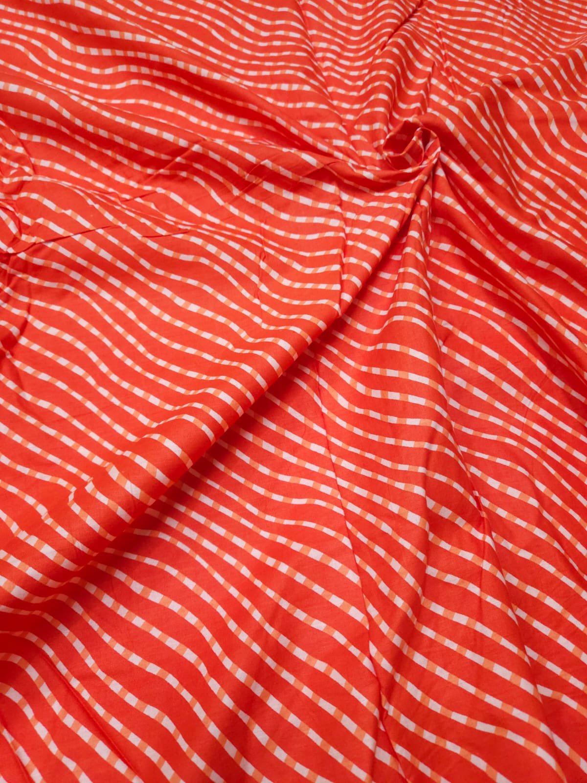 Orange Shade Lehariya Print, Cotton Fabric.