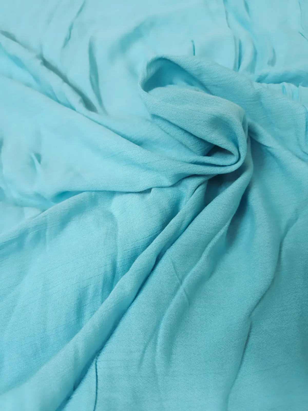 Sky Blue Shade Solid Rayon Crepe Fabric.