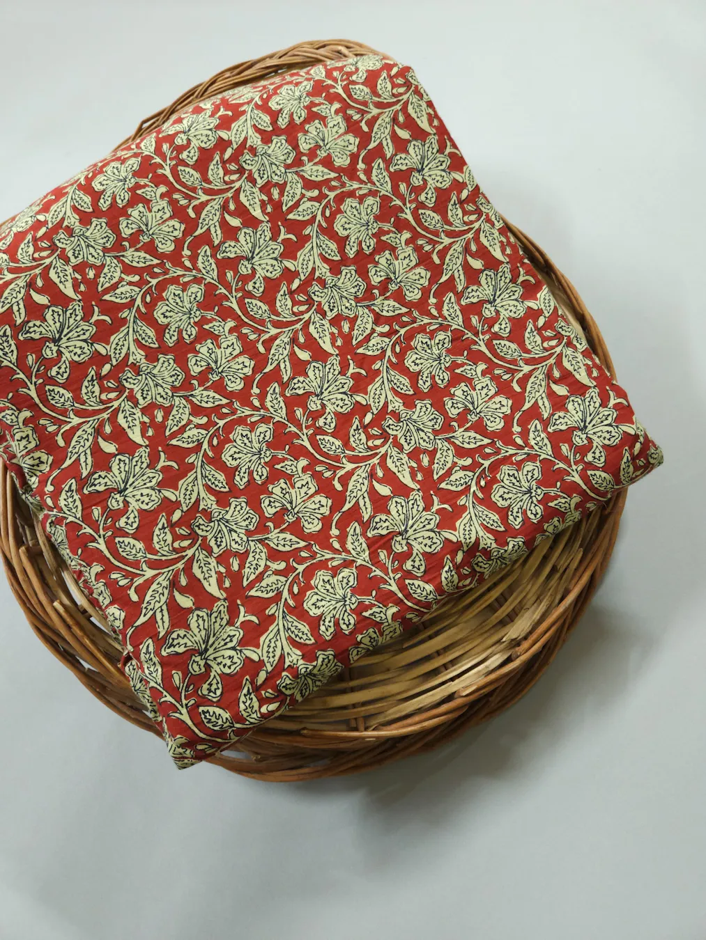 Traditional Kalamkari On Dark Red Base Background.