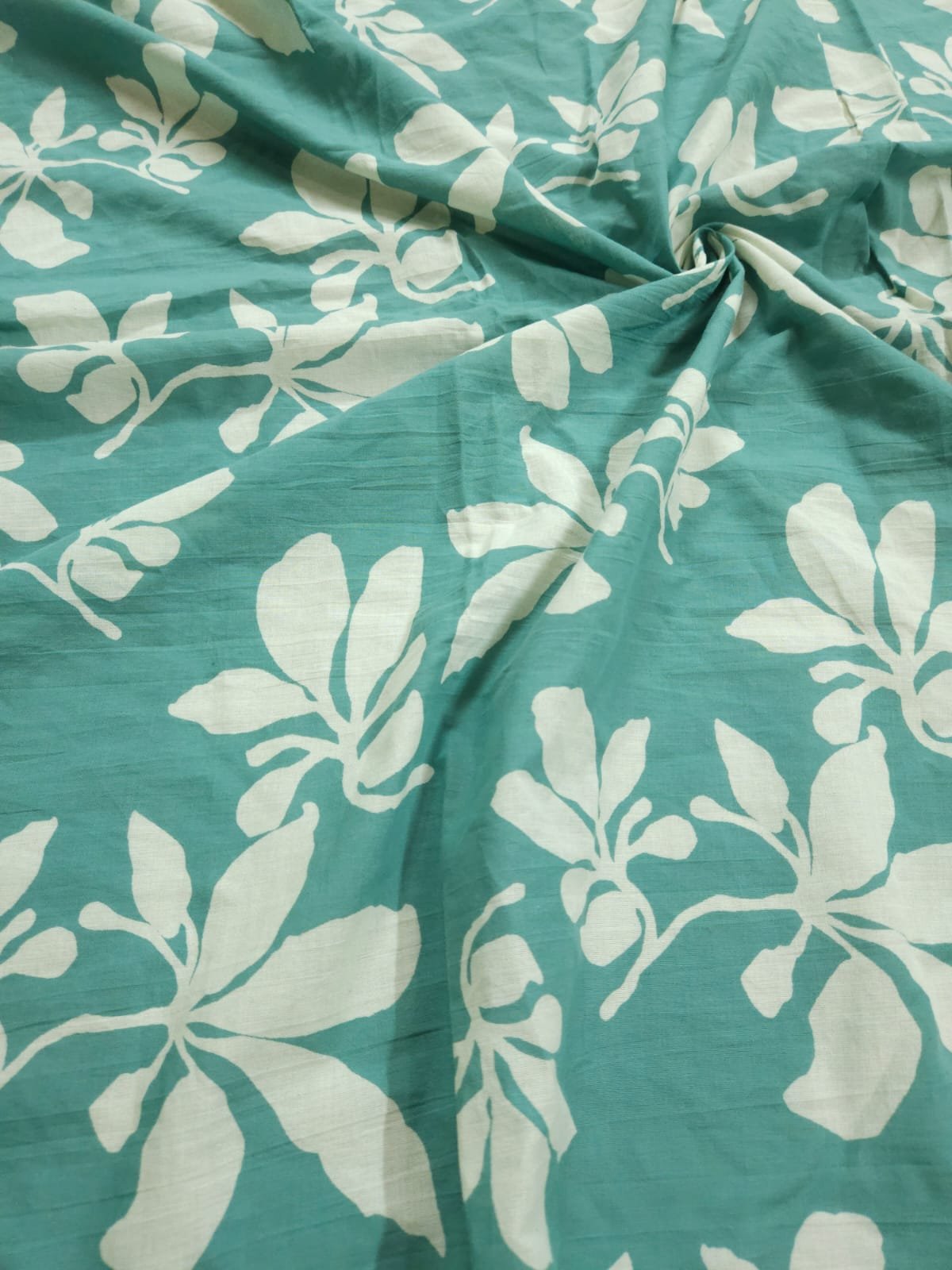 Pastel green shade base sanganeri flower block print.