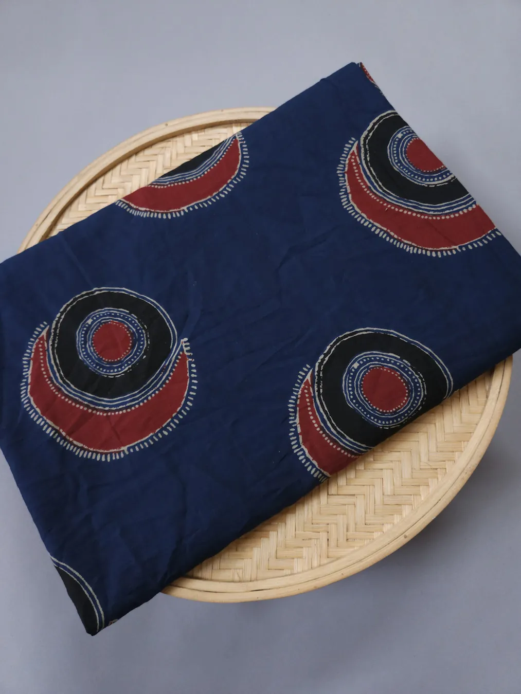 Indigo Base with Red and Black Evil Eye Printed Ajrakh Cotton Fabric