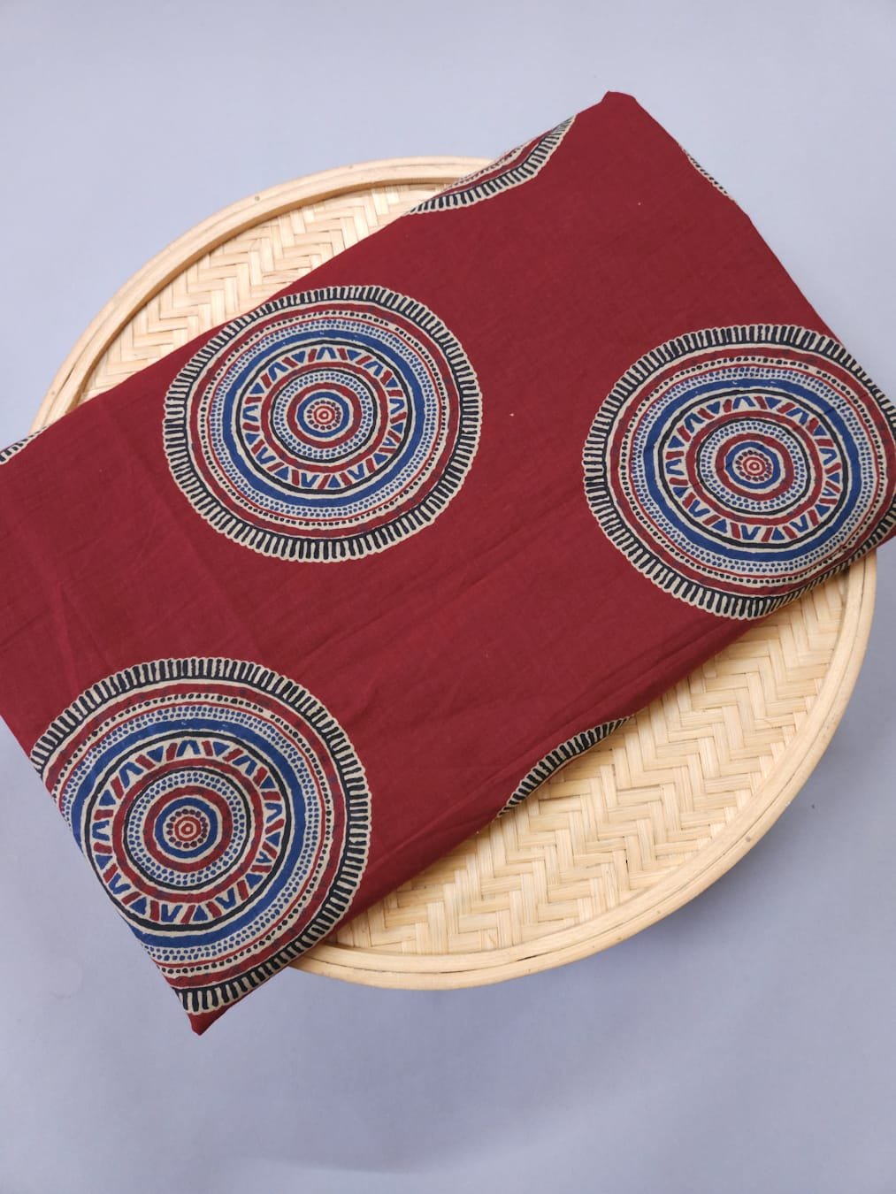 Maroon shade base ajrakh round figure print.
