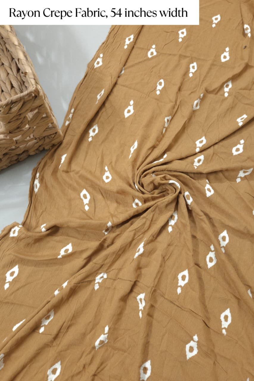 Golden shade base tilak block print figure, rayon crepe fabric
